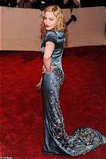 Butt Implant Rumors Sparked by Curvy Red Carpet Appearance