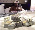 Floyd Mayweather Shows off Fortune with Stacks of $100 Bills Covering Table