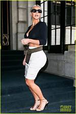 Kim Kardashian Flaunts Insane Cleavage, Pretends She Is Not Doing So