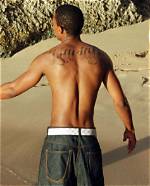 Nick Cannon Covers up “Mariah” Tattoo